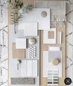 an overhead view of a white and grey color scheme with neutrals, greens, and textures