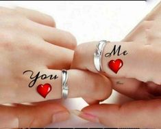 two people with matching rings that say you and me