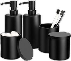 black bathroom accessories including soap dispenser, toothbrush holder and toiletries