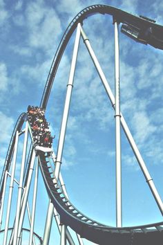 a roller coaster with people riding on it