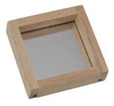 an empty wooden box with a mirror in the middle on a white background, top view