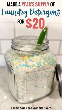 a jar filled with blue and yellow sprinkles sitting on top of a counter