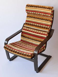 a striped chair sitting on top of a wooden frame