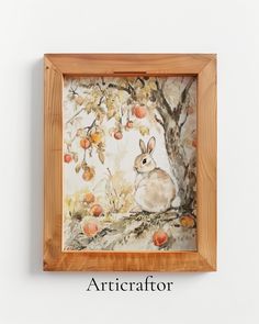 a painting of a rabbit sitting in an apple tree with the words articraff on it