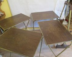 four wooden tables sitting on top of a hard wood floor