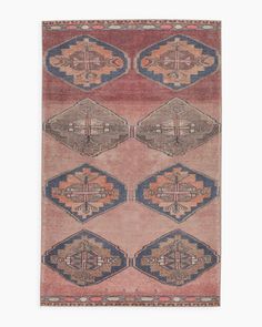 an antique rug with geometric design on the front and sides, all in different colors