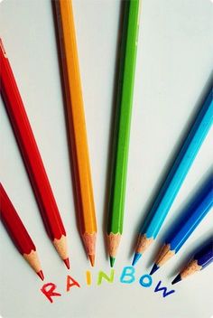 several colored pencils with the word rainbow written on them