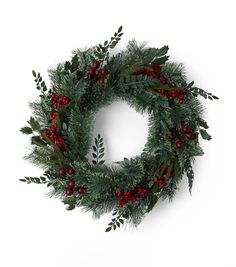 a christmas wreath with red berries and greenery on white background, viewed from above