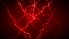 a red heart shaped lightning bolt in the dark