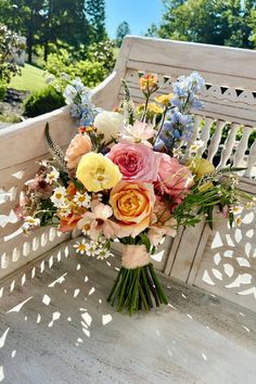 A Picture Of A Pastel Bouquet Against a Bench With Whimsical Flowers And Bright Colors. Bud Vase Centerpieces, July Wedding Flowers, June Wedding Flowers, Bud Vase Centerpiece, Wedding Flowers Diy, Diy Bridal Bouquet, Romantic Wedding Flowers, Flowers Pastel, Enchanting Garden