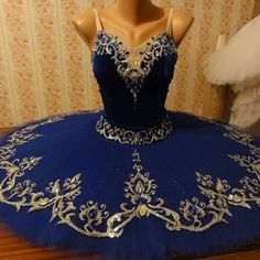 a mannequin is dressed up in a blue dress