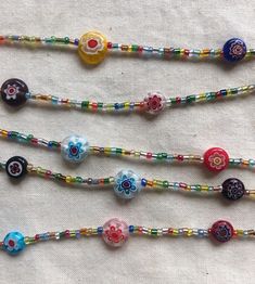 Hand-crafted, slow made pieces for your everyday living. Assembled in small batches with love.  Variations of crystals, stones to be expected and contributes to the individuality of each piece.  Instagram: @noontideandnight  https://www.instagram.com/noontideandnight/ [Fio Mask Chain] ' Assorted translucent seed beads, bungles, millefiori round-shaped glass beads ' Measures between 62 - 66 cm in length [Fio Necklace]  ' Assorted translucent seed beads, bungles, millefiori round-shaped glass bead Colorful Adjustable Glass Beaded Necklaces, Festival Czech Glass Beaded Necklaces With Faceted Beads, Bohemian Glass Beaded Bracelets With Polished Beads, Multicolor Beaded Crystal Necklaces In Czech Glass, Handmade Glass Beads For Jewelry Making, Murano Glass Beaded Necklace As Gift, Adjustable Murano Glass Beaded Necklace For Gifts, Multicolor Czech Glass Crystal Necklaces With Round Beads, Multicolor Czech Glass Spiritual Beaded Necklaces