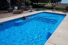 an empty swimming pool in the middle of a yard