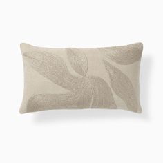 a white pillow with an abstract design on it