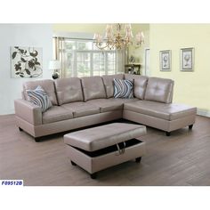 a living room scene with focus on the couch and ottoman