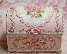 a pink and white box with flowers on it