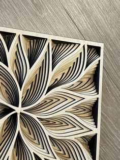 an intricate wood carving pattern on the side of a wall