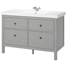 a bathroom vanity with two drawers and a white counter top on one side, and a single faucet sink on the other