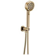 a shower head with thermostaer and handset in brushed brass finish on an isolated white background