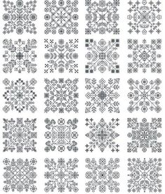 an assortment of snowflakes on white paper with different shapes and sizes, all in grey