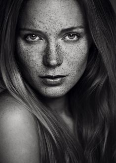 a beautiful woman with freckles on her face