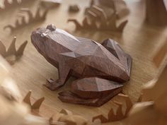 a wooden frog sitting on top of a table