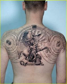 the back of a man's upper body with tattoos on it and an image of a person riding a horse