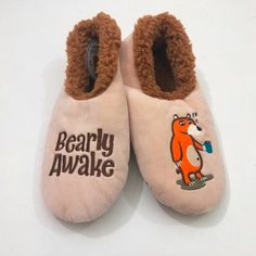 Nwt, New With Tags, Sales Samples, Are Tan With Brown Faux Fur Lining. One Slipper Has A Sleepy Orange Bear Holding A Blue Cup Filled With Coffee. The Other Slipper Has "Bearly Awake" On It. We All Know Someone Like This Who Needs Their Morning Coffee! These Cute Slippers Are Perfect For Whoever Needs That Cup Of Morning Coffee. They Will Keep Your Feet Warm & Comfy While Enjoying That Morning Cup Of Coffee! Fun Slippers With Non-Skid Soles. Brand Snoozies Cozy Little Foot Coverings Made In Chin Smores Slippers, Casual Winter Slippers For Leisure, Casual Winter Leisure Slippers, Super Soft Casual Slippers For Leisure, Casual Super Soft Slippers For Leisure, Super Soft Closed Toe Casual Slippers, Super Soft Casual Closed Toe Slippers, Casual Super Soft Closed Toe Slippers, Casual Closed Toe Super Soft Slippers