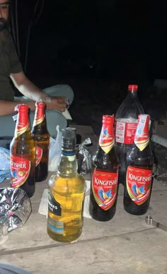 several bottles of beer are sitting on a table