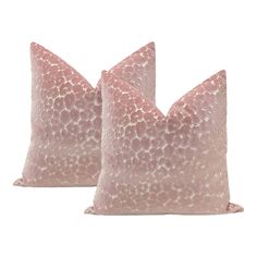 two pink pillows with white spots on them