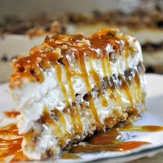 a piece of cheesecake on a plate with caramel sauce