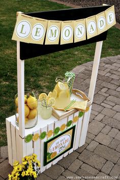 a lemonade stand with lemons on it