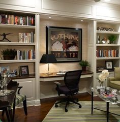 a living room filled with furniture and bookshelves next to a wall mounted book shelf