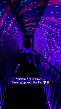 the inside of a tunnel with lights on it and text that reads museum of illusion is turning spooky for fall