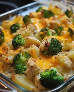 a casserole dish with broccoli, chicken and cheese