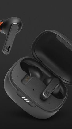 the jbl sport wireless earbuds are black and have an orange logo on them