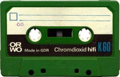 an old green and white cassette with the words made in germany on it's side