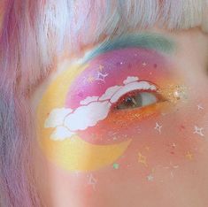 a close up of a person's face with colorful makeup