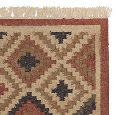 an old rug is shown with fringes on the bottom and one end in red, brown