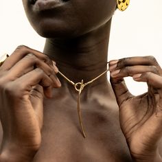 The Amali Lariat Necklace introduces a new curved quill silhouette for SOKO. This piece makes an impactful addition to your layers or makes for a beautiful, unique solo statement piece. In Swahili, Amali means hope. Handcrafted by artisans in Kenya with 24k gold plated brass using traditional casting techniques. Length: 20.07in (510mm)Brass Tube; 0.23in x 0.11in (6mm x 3mm)Toggle Dimension: 0.78in (20mm)Pendant Dimension: 2.36in x 0.15in (60mm x 4mm) Luxury Long Drop Brass Jewelry, Dope Jewelry Accessories, Gold Lariat Necklace, Modern Gold Jewelry, Toggle Necklace, Dope Jewelry, Stylish Bracelet, Leather Chokers, Lariat Necklace