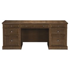 an executive desk with three drawers and one file drawer on the left side, in dark wood