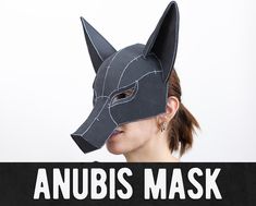 anubis mask made out of black paper with the words, anubis mask