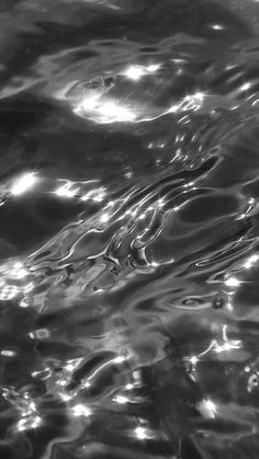 black and white photograph of water with ripples