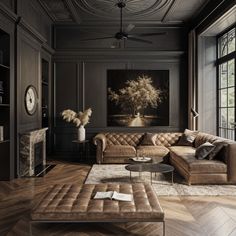 a living room filled with furniture and a painting on the wall above it's fireplace