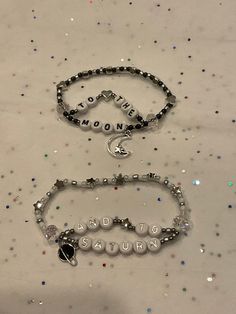 "Matching set of bracelets with the lyrics \"to the moon and to Saturn\" on them. Can be made to a certain length with stretchable string. The current charms are seen in the second picture. The bracelet can be done in gold or silver with the planet either being black or white. Please note that these bracelets will be made to order." Love You To The Moon And To Saturn Bracelet, To The Moon And To Saturn Bracelet, Exile Bracelet Taylor Swift, Moon And Saturn Bracelet, Tiny Bead Bracelet Patterns, Beaded Bracelets Friendship, Adjustable White Moon Shaped Bracelets, Adjustable White Moon Bracelet, Adjustable White Moon-shaped Bracelets