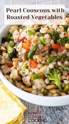 pearl couscous with roasted vegetables in a white bowl