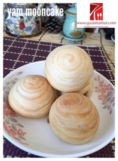 three small pastries on a plate with the words van mooncake written above them