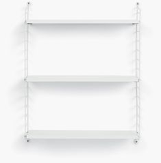 two white shelves on the wall