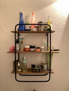 a bathroom shelf filled with different types of personal care products on top of each other