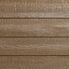 a close up view of the wood grains on a house's exterior wall